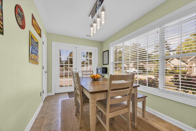 4104 Friendfield Trce, Little River, SC 29566 - dining area with french doors, baseboards, and light tile patterned floors