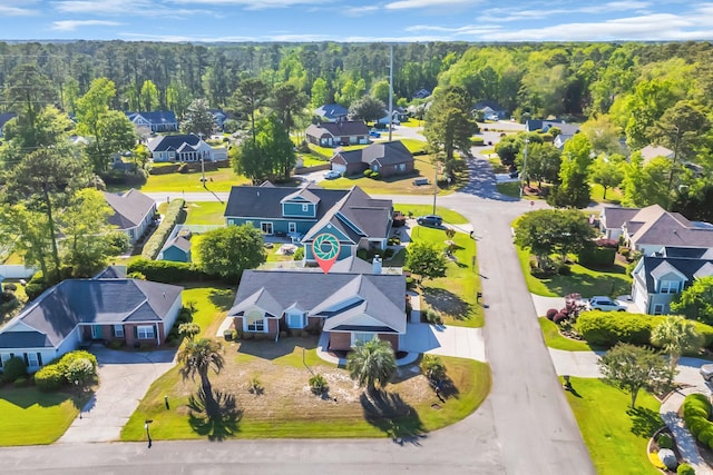bird's eye view with a residential view and a forest view