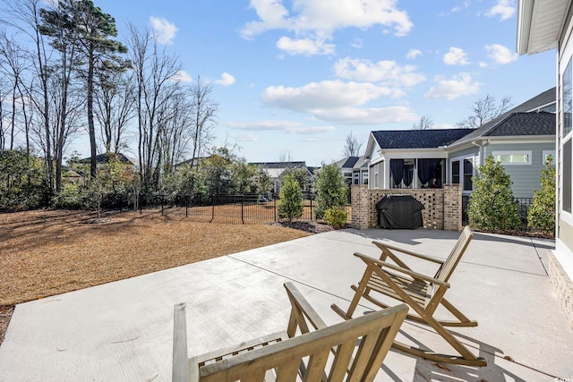 view of patio featuring fence and area for grilling