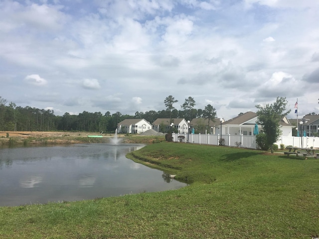 water view with fence and a residential view