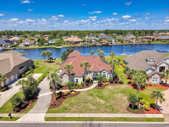bird's eye view with a water view and a residential view
