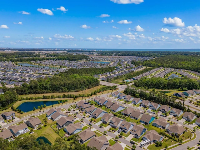 aerial view with a residential view and a water view