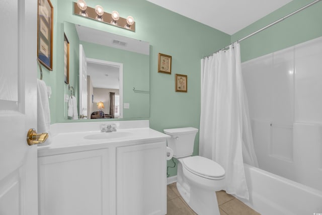 260 Connemara Dr Unit E, Myrtle Beach, SC 29579 - bathroom featuring vanity, toilet, tile patterned floors, shower / bath combo with shower curtain, and visible vents