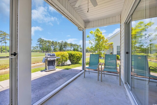 260 Connemara Dr Unit E, Myrtle Beach, SC 29579 - unfurnished sunroom featuring a ceiling fan