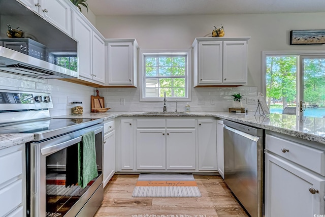 104-4 Gully Branch Ln Unit 4, Myrtle Beach, SC 29572 - kitchen featuring stainless steel appliances, a sink, light wood-style floors, and white cabinets