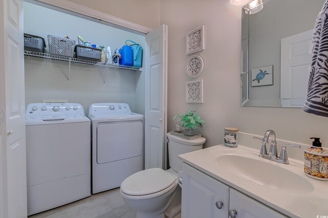 104-4 Gully Branch Ln Unit 4, Myrtle Beach, SC 29572 - bathroom featuring toilet, vanity, and washer and dryer