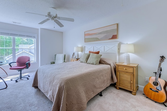 104-4 Gully Branch Ln Unit 4, Myrtle Beach, SC 29572 - bedroom featuring light carpet, a textured ceiling, ceiling fan, and baseboards