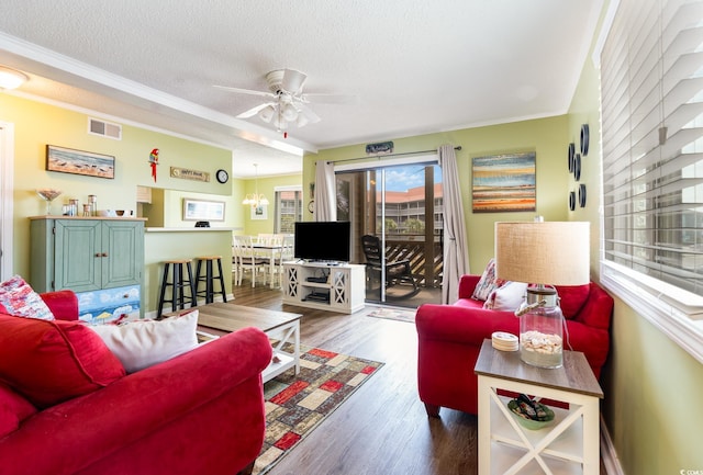 609 Hillside Dr S Unit C-10, North Myrtle Beach, SC 29582 - living room with ornamental molding, wood finished floors, a textured ceiling, and a ceiling fan
