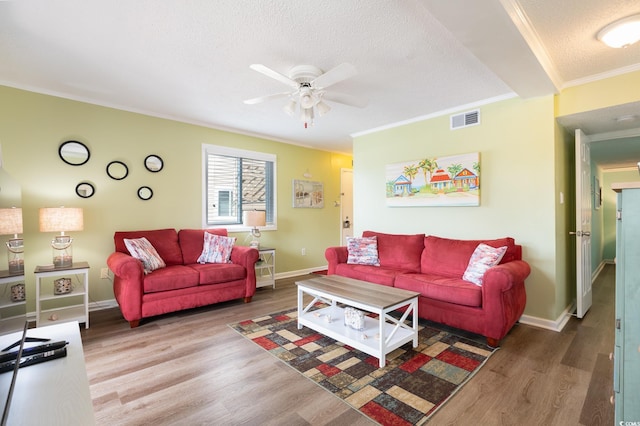 609 Hillside Dr S Unit C-10, North Myrtle Beach, SC 29582 - living room featuring a textured ceiling, crown molding, a ceiling fan, and wood finished floors