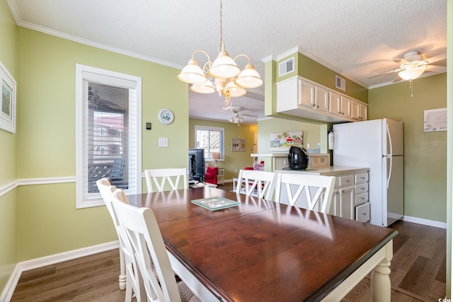 609 Hillside Dr S Unit C-10, North Myrtle Beach, SC 29582 - dining room featuring ceiling fan, dark wood-type flooring, a chandelier, a desk, and crown molding