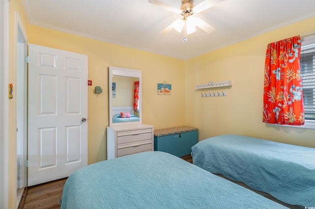 609 Hillside Dr S Unit C-10, North Myrtle Beach, SC 29582 - bedroom featuring wood finished floors, crown molding, and a ceiling fan