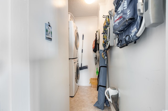 609 Hillside Dr S Unit C-10, North Myrtle Beach, SC 29582 - laundry area featuring stacked washer / drying machine and a textured ceiling