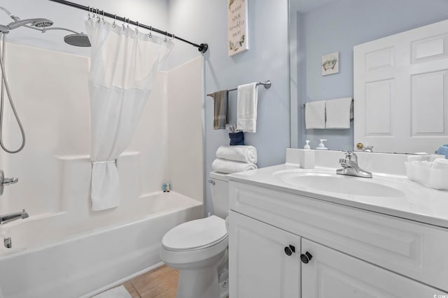 full bath with shower / tub combo, toilet, vanity, and tile patterned floors