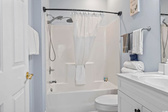 full bath with shower / bath combination with curtain, toilet, and vanity