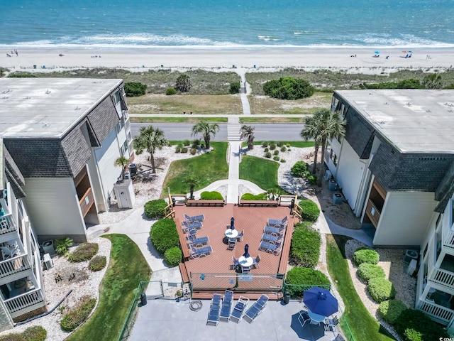drone / aerial view featuring a view of the beach and a water view