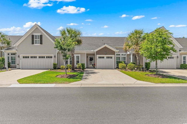 232 Je Edward Dr Unit 21, Myrtle Beach, SC 29588 - townhome / multi-family property with driveway, a shingled roof, and a front lawn