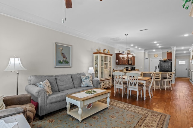 232 Je Edward Dr Unit 21, Myrtle Beach, SC 29588 - living room with crown molding, visible vents, dark wood-type flooring, recessed lighting, and ceiling fan with notable chandelier
