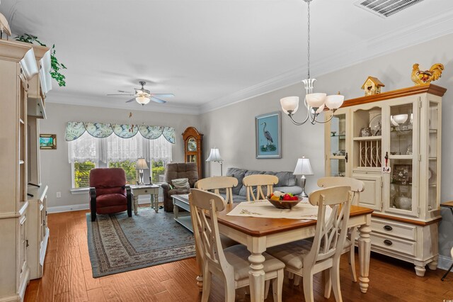 232 Je Edward Dr Unit 21, Myrtle Beach, SC 29588 - dining room featuring crown molding, visible vents, light wood-style flooring, and ceiling fan with notable chandelier