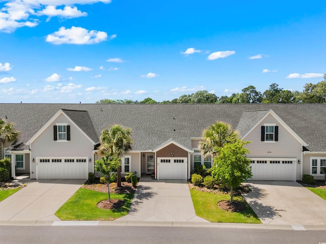 232 Je Edward Dr Unit 21, Myrtle Beach, SC 29588 - view of front of home with an attached garage, a shingled roof, and concrete driveway