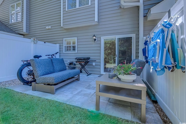 view of patio featuring a fenced backyard and outdoor lounge area