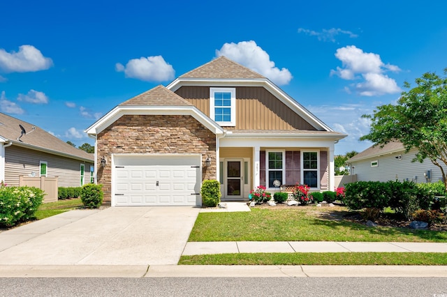 962 Witherbee Way, Little River, SC 29566 - craftsman inspired home featuring a front lawn, stone siding, board and batten siding, an attached garage, and driveway