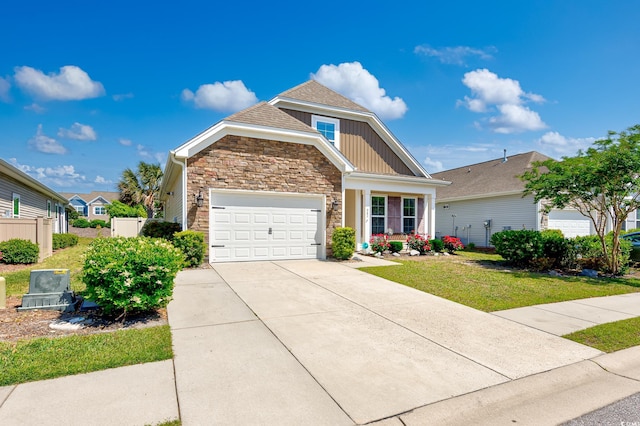 962 Witherbee Way, Little River, SC 29566 - craftsman-style home featuring driveway, a front yard, fence, an attached garage, and stone siding
