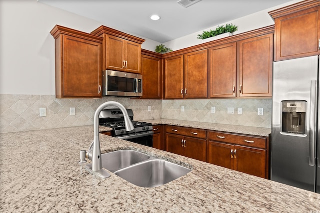 962 Witherbee Way, Little River, SC 29566 - kitchen with light stone countertops, appliances with stainless steel finishes, and decorative backsplash