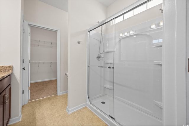 962 Witherbee Way, Little River, SC 29566 - full bath with vanity, baseboards, a stall shower, and a spacious closet