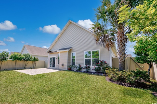 962 Witherbee Way, Little River, SC 29566 - rear view of property with a yard, a fenced backyard, and a patio area