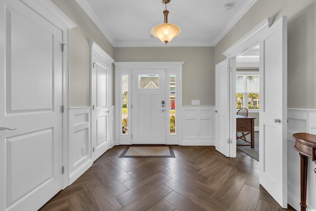 1136 Doubloon Dr, North Myrtle Beach, SC 29582 - foyer with ornamental molding, wainscoting, and a decorative wall