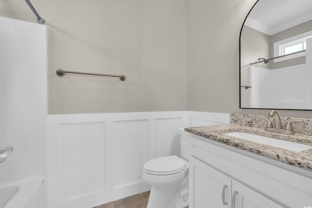 1136 Doubloon Dr, North Myrtle Beach, SC 29582 - bathroom featuring crown molding, vanity, a decorative wall, toilet, and a wainscoted wall