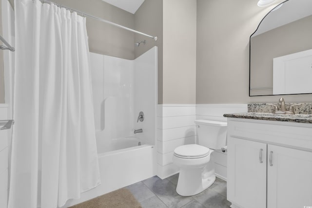 1136 Doubloon Dr, North Myrtle Beach, SC 29582 - bathroom with shower / bath combo, vanity, a wainscoted wall, tile patterned floors, and toilet