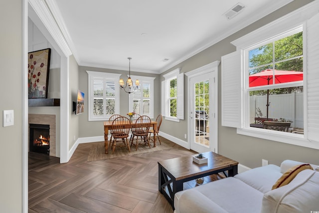 1136 Doubloon Dr, North Myrtle Beach, SC 29582 - living room featuring baseboards, crown molding, visible vents, and an inviting chandelier