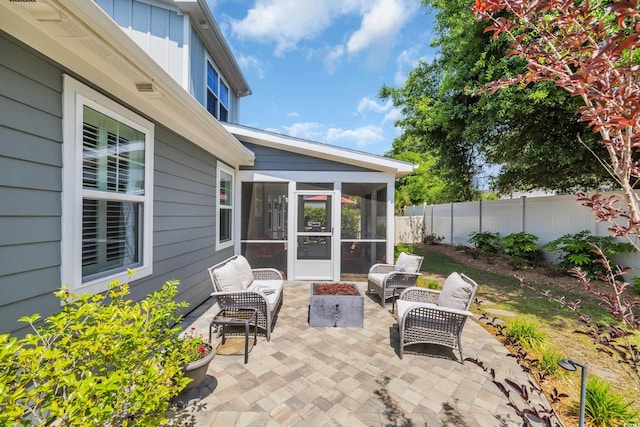 1136 Doubloon Dr, North Myrtle Beach, SC 29582 - view of patio featuring a fenced backyard, a sunroom, and an outdoor hangout area