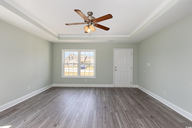 469 Overcrest St, Myrtle Beach, SC 29579 - spare room with a raised ceiling, ornamental molding, dark wood-style floors, and a ceiling fan