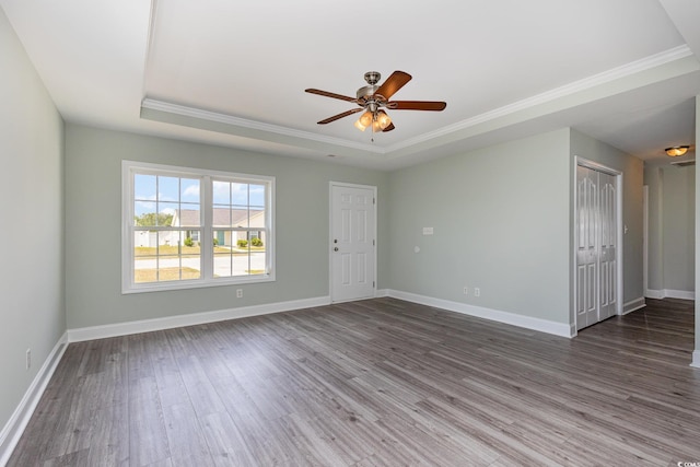 469 Overcrest St, Myrtle Beach, SC 29579 - spare room with a raised ceiling, crown molding, wood finished floors, and a ceiling fan