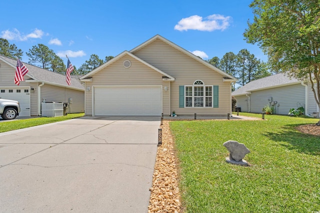 ranch-style home featuring a garage, concrete driveway, and a front yard