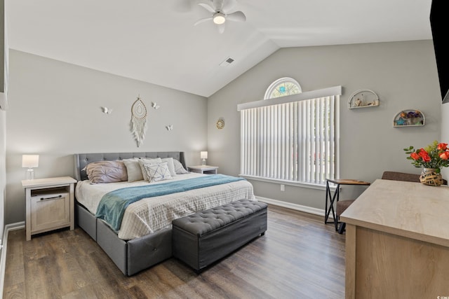 bedroom featuring ceiling fan, visible vents, vaulted ceiling, baseboards, and dark wood-type flooring