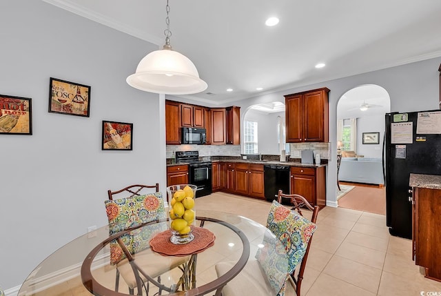 kitchen with arched walkways, recessed lighting, decorative backsplash, ornamental molding, and black appliances