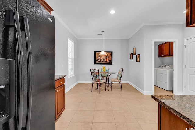 dining room featuring crown molding, baseboards, separate washer and dryer, recessed lighting, and light tile patterned flooring