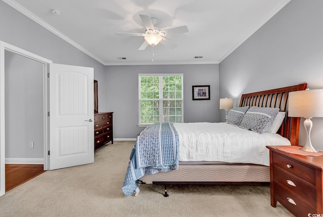 bedroom featuring crown molding, baseboards, ceiling fan, and light carpet