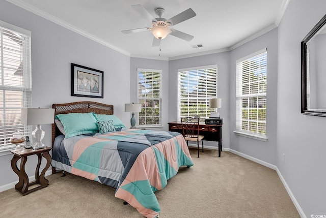 bedroom with crown molding, baseboards, ceiling fan, and carpet