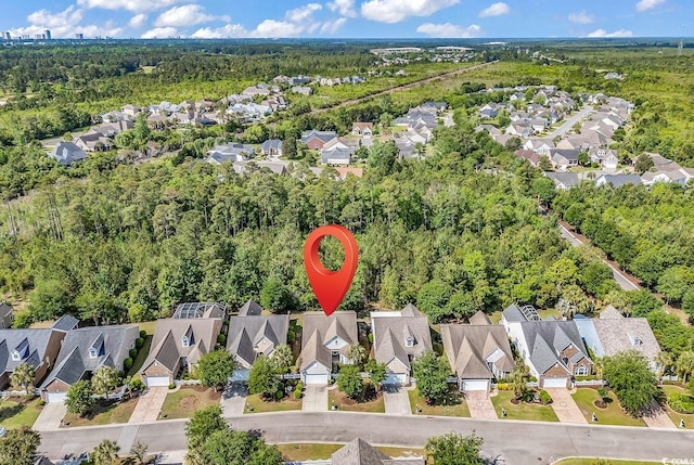 aerial view featuring a residential view and a forest view