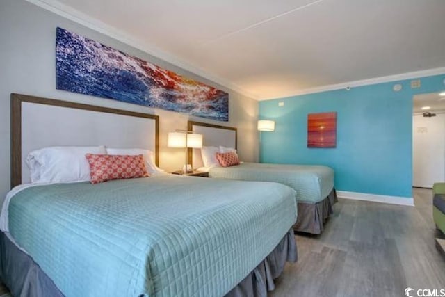 7200 N Ocean Blvd Unit 436, Myrtle Beach, SC 29572 - bedroom with crown molding, baseboards, and wood finished floors
