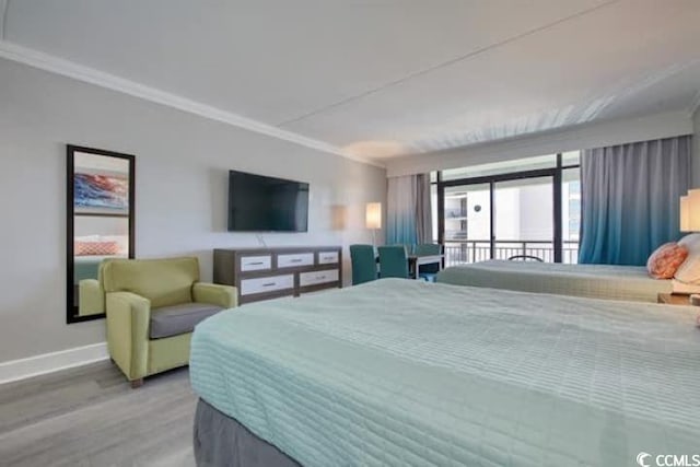 7200 N Ocean Blvd Unit 436, Myrtle Beach, SC 29572 - bedroom with crown molding, baseboards, and wood finished floors