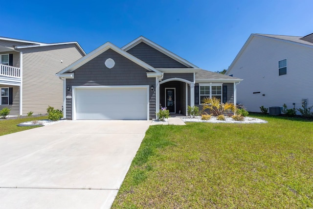 428 Calhoun Falls Dr, Myrtle Beach, SC 29579 - view of front of house featuring a garage, concrete driveway, a front yard, and central air condition unit