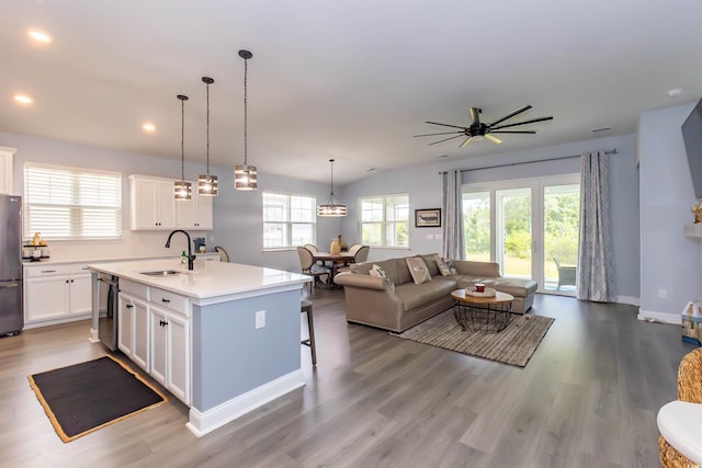 428 Calhoun Falls Dr, Myrtle Beach, SC 29579 - kitchen with a sink, freestanding refrigerator, open floor plan, a kitchen island with sink, and dishwasher