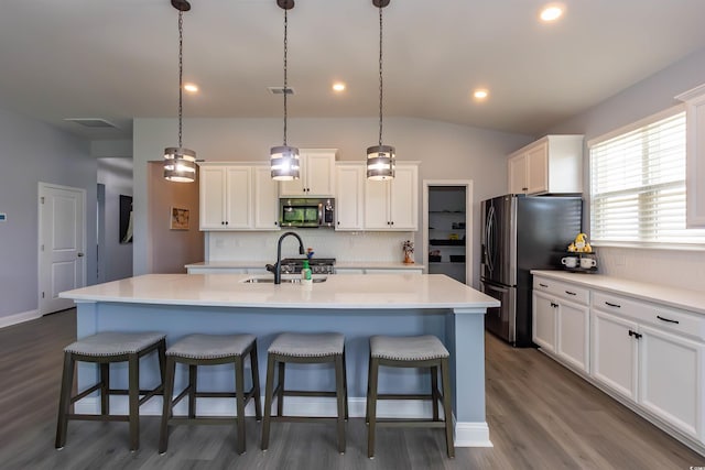 428 Calhoun Falls Dr, Myrtle Beach, SC 29579 - kitchen with stainless steel appliances, a sink, backsplash, white cabinets, and recessed lighting