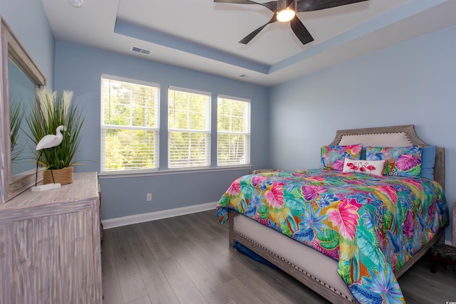 428 Calhoun Falls Dr, Myrtle Beach, SC 29579 - bedroom featuring a raised ceiling, baseboards, wood finished floors, and ceiling fan