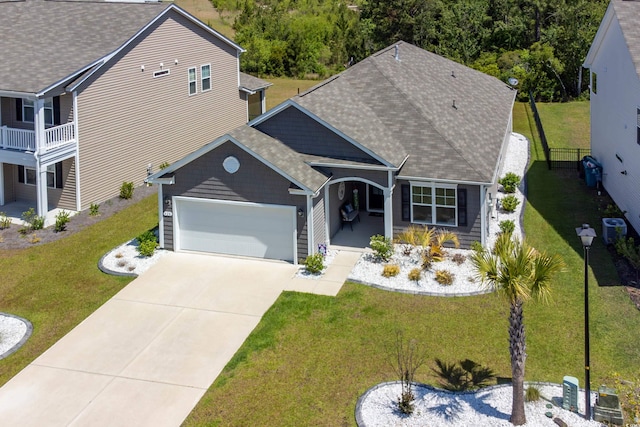 428 Calhoun Falls Dr, Myrtle Beach, SC 29579 - view of front of house with concrete driveway, a garage, a front lawn, and roof with shingles